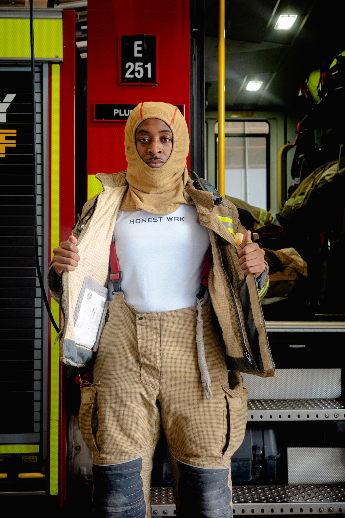 Honest Wrk campaign portrait at a fire station